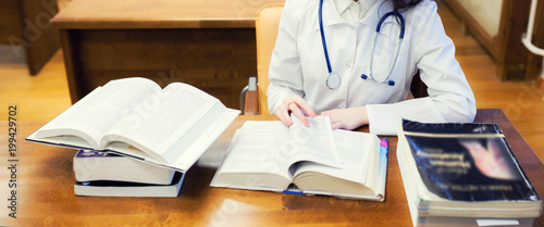 classical training. background a medical student for textbooks. The study of surgery by a beautiful girl in the library