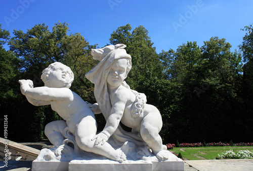Statue of children playing in park