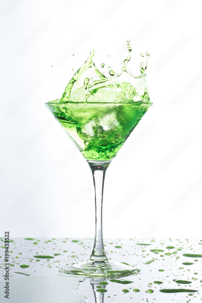 green cocktail spalsh water on white background green cocktail spalsh water on white background