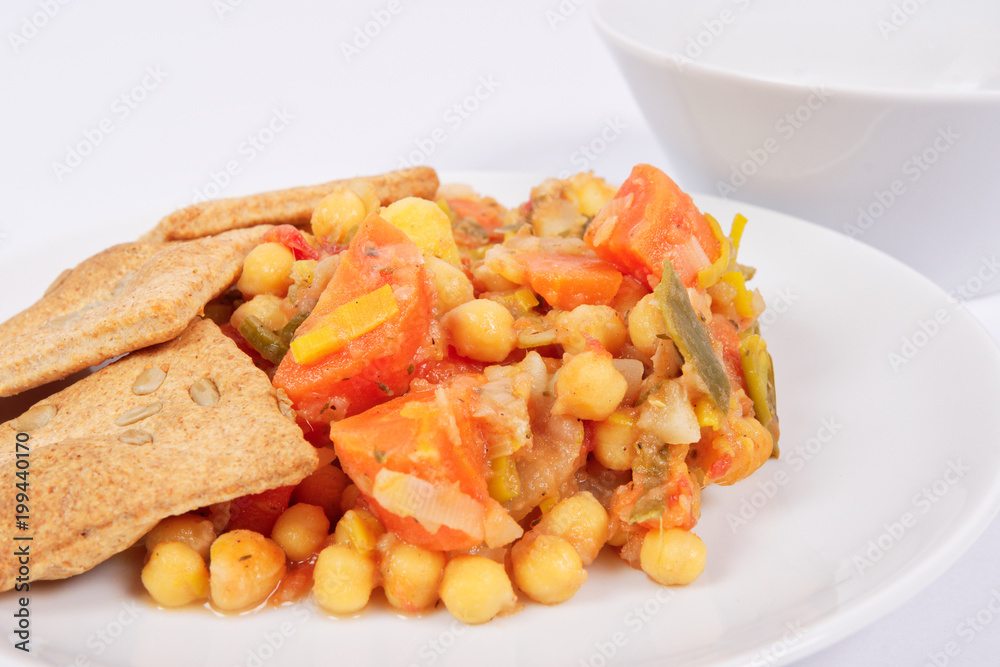Baked vegetables and cheese biscuits on a white Baked vegetables and cheese biscuits on a white