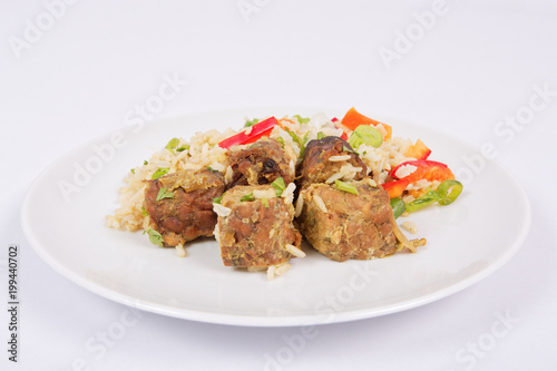 Thai tempeh with coriander and rice on a white