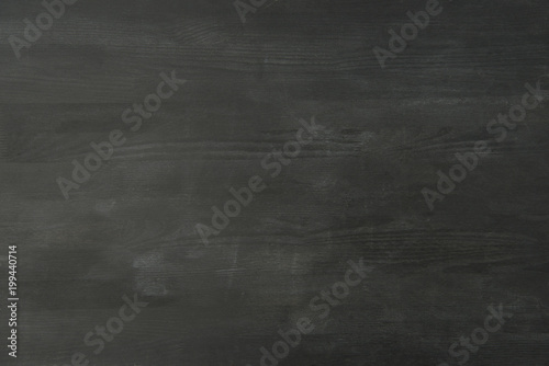 top view of empty black wooden tabletop as background