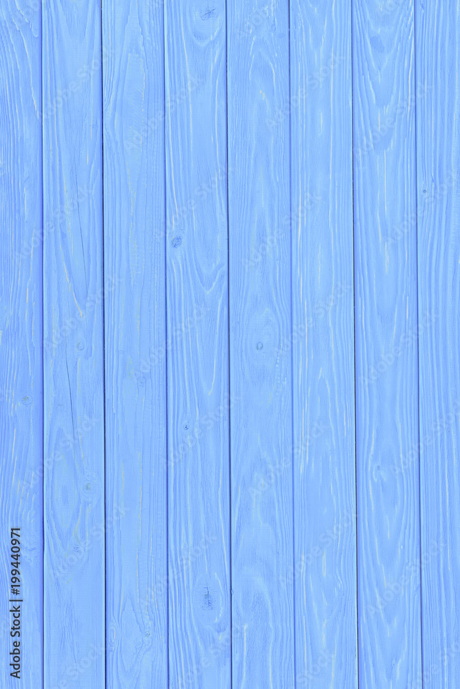 Wooden vertical planks painted in blue background Wooden vertical planks painted in blue background