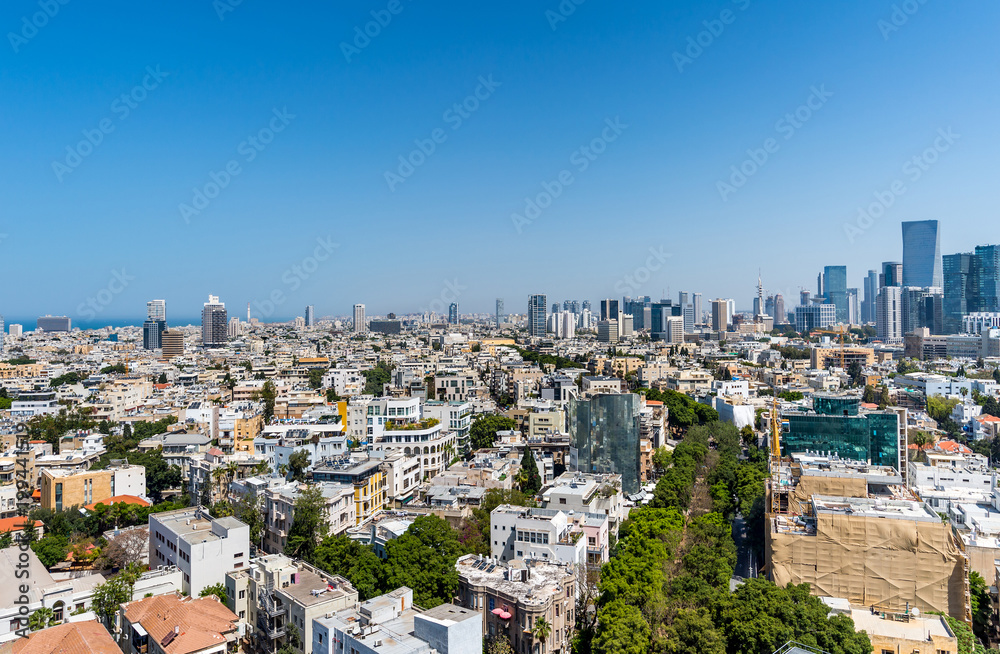 Rooftop view of boulevard Rothschild in Tel Aviv.  Old houses and modern skyscrapers.