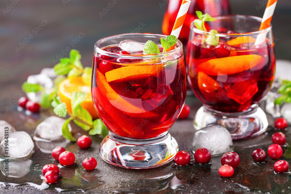 Summer drink Sangria with orange and cranberry. Selective focus. Copy space Summer drink Sangria with orange and cranberry. Selective focus. Copy space