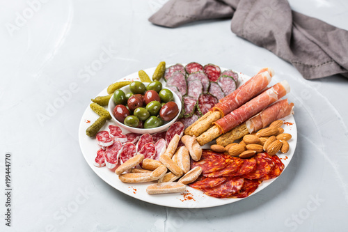 Assortment of spanish tapas or italian antipasti with meat