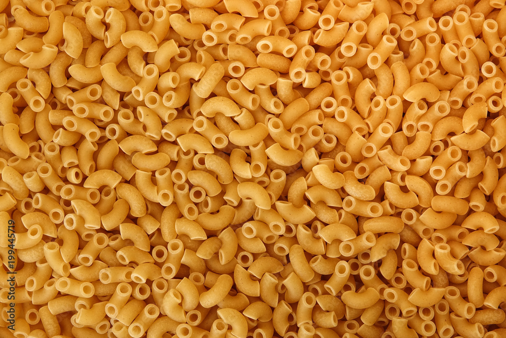 Close up of uncooked macaroni / pasta. Texture for background. Copy space for text. Close up of uncooked macaroni / pasta. Texture for background. Copy space for text.