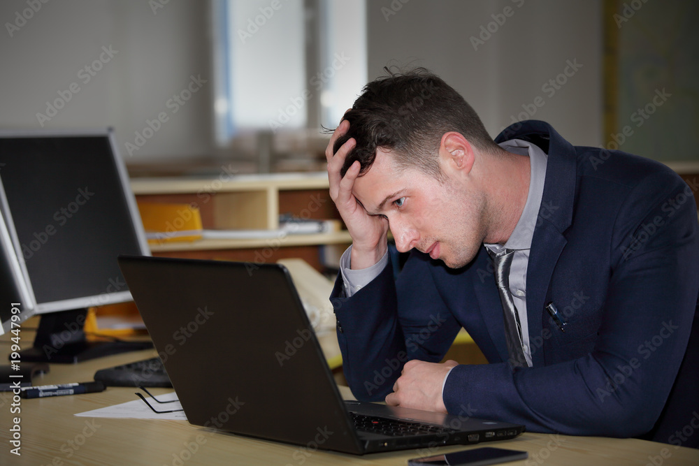 A young manager working on a computer A young manager working on a computer