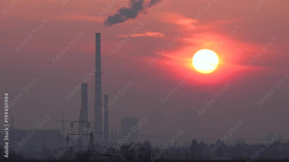 Skylines of an urban area stand against the red sunset Skylines of an urban area stand against the red sunset