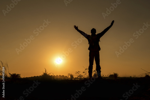 Silhouette man with sunset , Independent of work