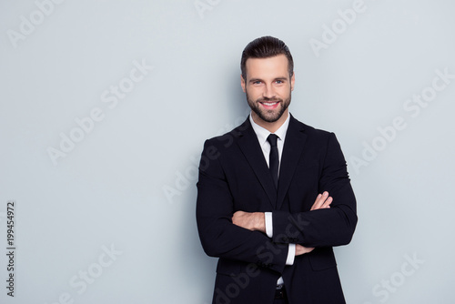 People occupation leadership profession concept. Portrait of cheerful excited confident handsome smart intelligent modern with stylish hairdo expert representative isolated on gray background photo