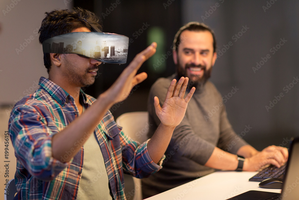 augmented reality and technology concept - developers with singapore city on virtual headset or 3d glasses screen working late at night office