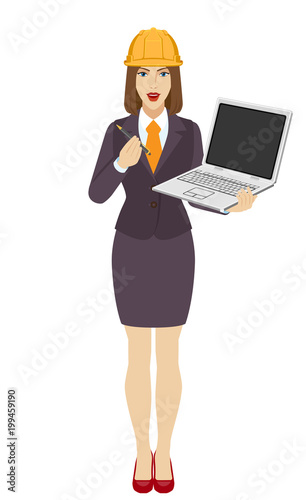 Businesswoman in construction helmet  holding a laptop notebook and giving pen or stylus for your electronic signature