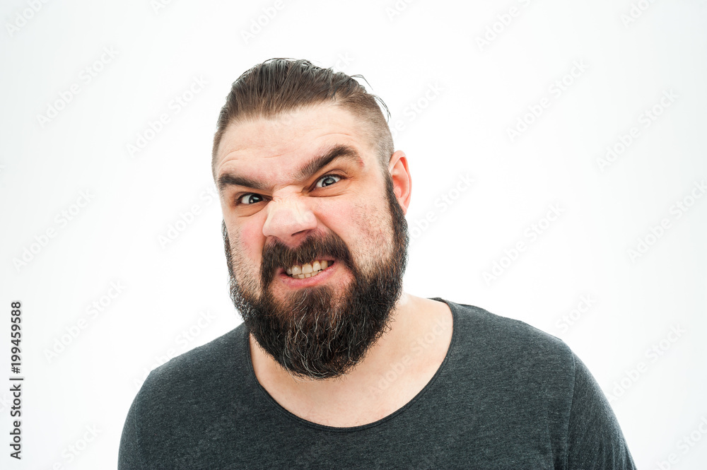 Closeup portrait of angry, mad, annoyed, skeptical, grumpy man, employee, worker isolated on white background. Human emotions, face expressions, reaction, interpersonal conflict resolution Closeup portrait of angry, mad, annoyed, skeptical, grumpy man, employee, worker isolated on white background. Human emotions, face expressions, reaction, interpersonal conflict resolution