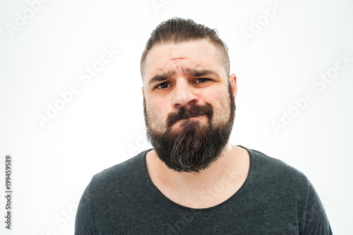 Closeup portrait of angry, mad, annoyed, skeptical, grumpy man, employee, worker isolated on white background. Human emotions, face expressions, reaction, interpersonal conflict resolution