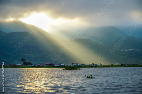 Crepuscular Rays. Sun Shining Through Clouds at Inle Lake in Myanmar  Burma 