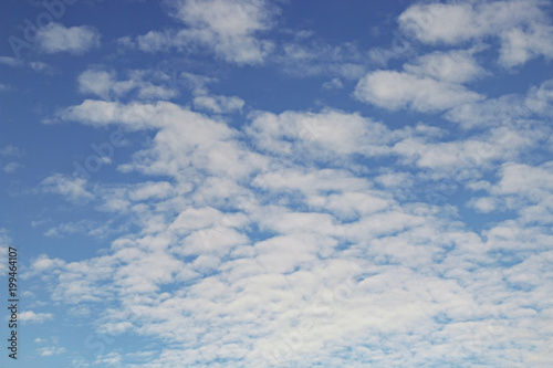 Fototapeta Naklejka Na Ścianę i Meble -  Blue sky background with tiny clouds