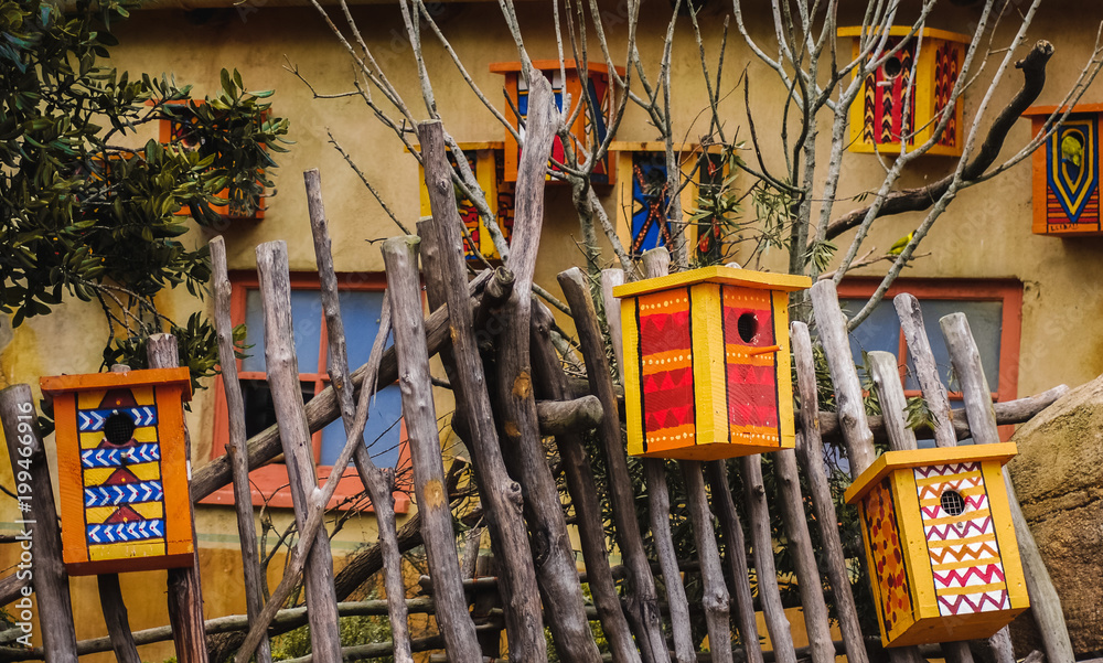 Several colourful bird houses
