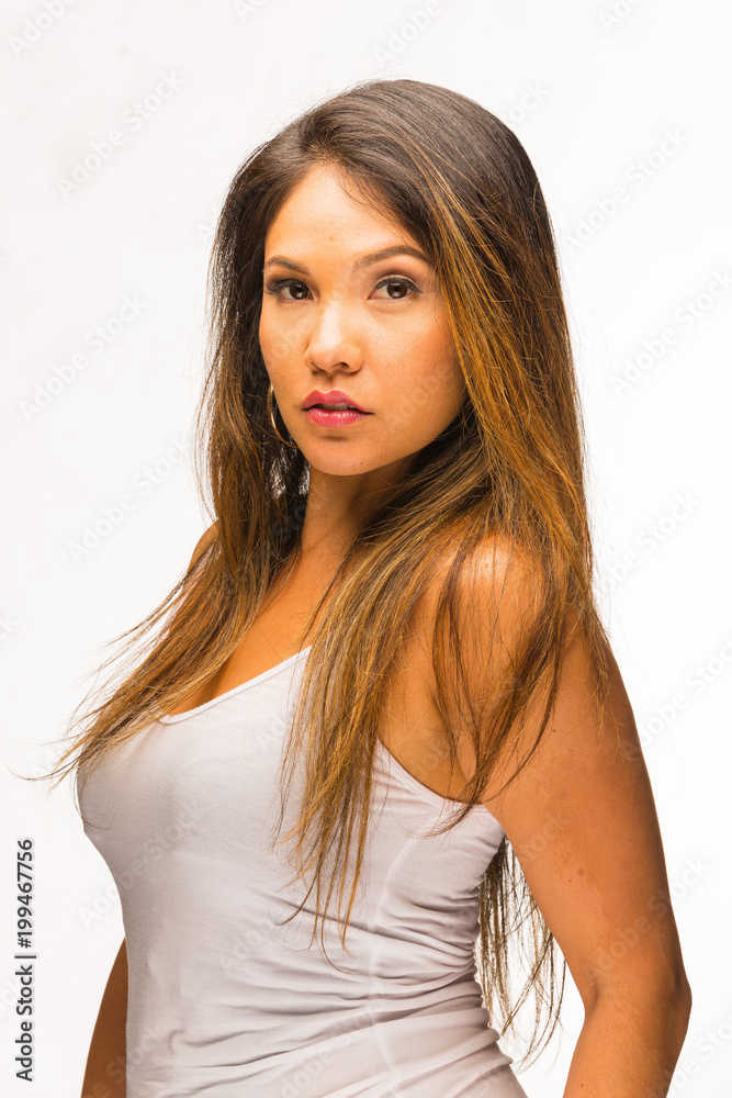 young Pacific Islander woman in white top headshot against clean white background young Pacific Islander woman in white top headshot against clean white background