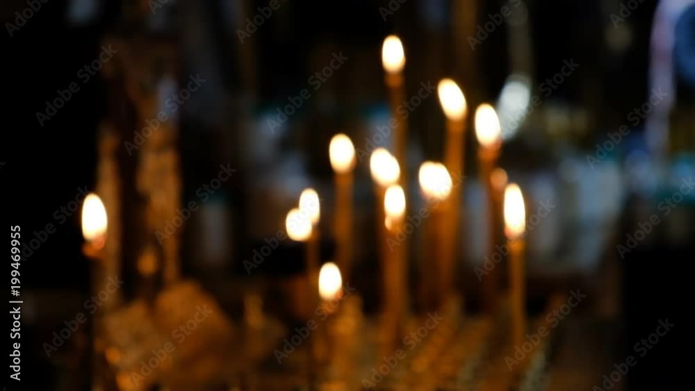 Candles burn in the temple on a religious holiday. Candles burn in the temple on a religious holiday.