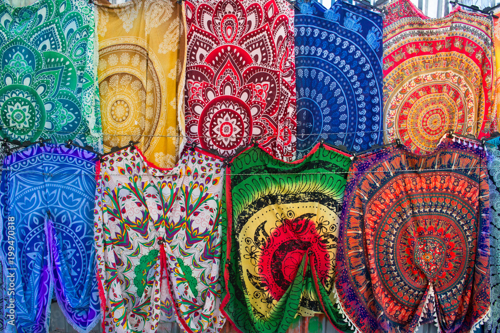 Bright colourful Arabian, Turkish, oriental traditional babushka shawls, rugs, kerchiefs