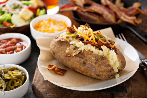 Loaded baked potato with bacon and cheese