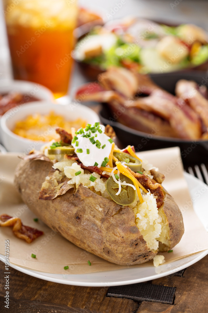 Loaded baked potato with bacon and cheese Loaded baked potato with bacon and cheese