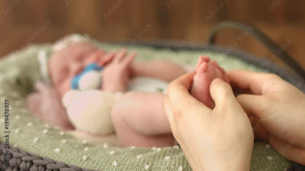 Baby's foot is in mom's hand Baby's foot is in mom's hand