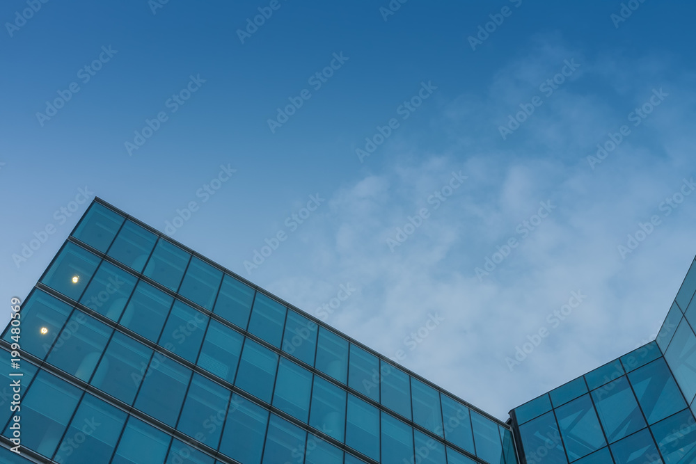 Glass facade, modern architecture with blue sky, morning shoot Glass facade, modern architecture with blue sky, morning shoot