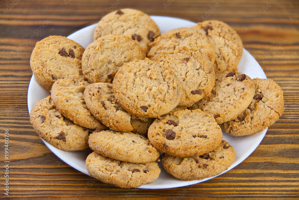 delicious appetizing cookies with chocolate on plate delicious appetizing cookies with chocolate on plate