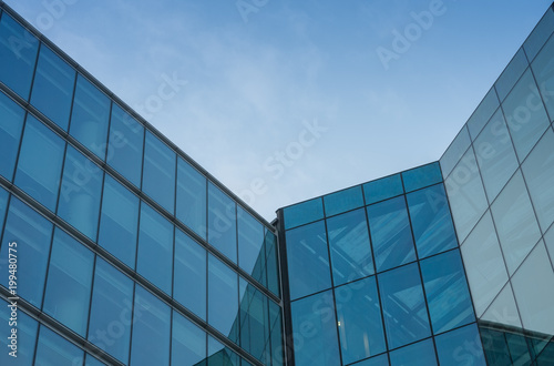 Glass facade  modern architecture with blue sky  morning shoot