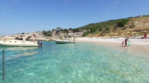 Boat parked next to beach in Albania photo