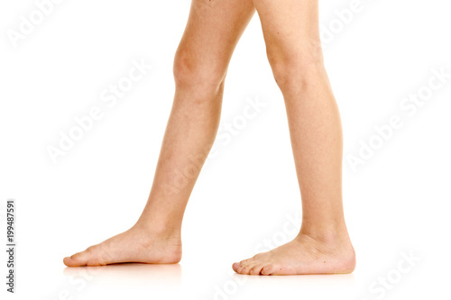 Side-view of barefoot legs photo