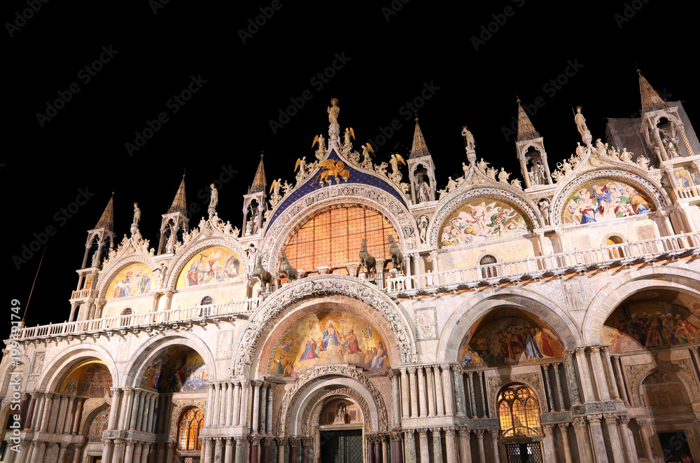 Illuminated San Marco Basilica with black sky at night with long