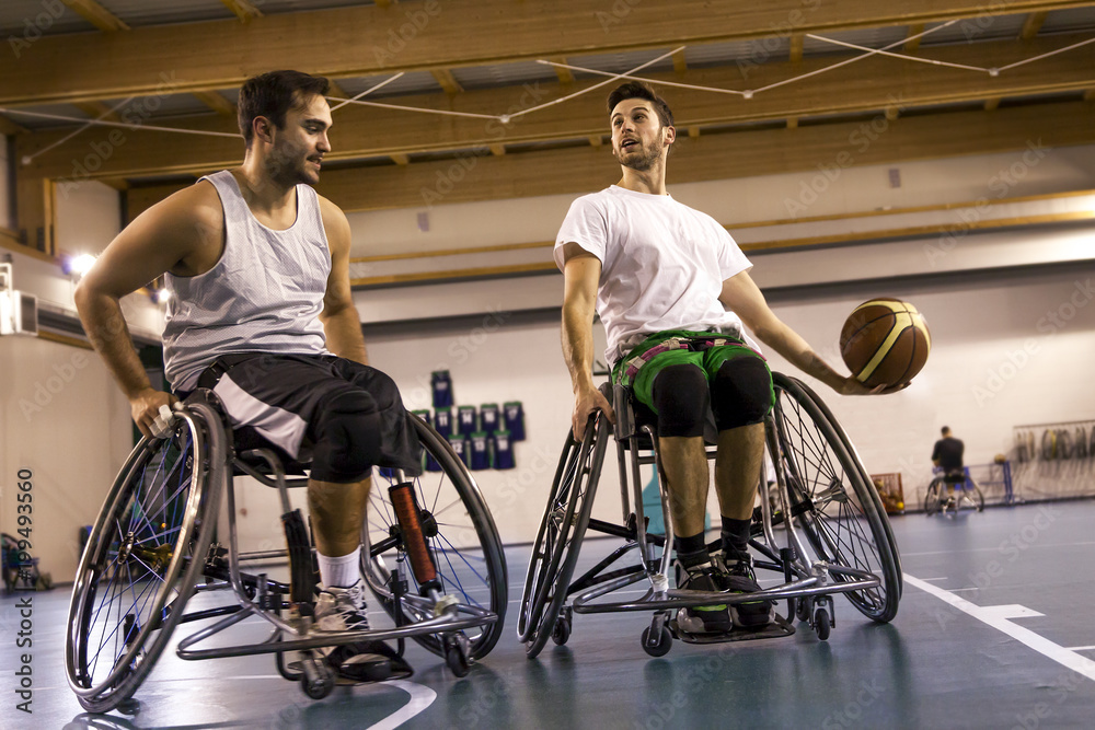 disabled sport men in action while playing basketball - obrazy, fototapety, plakaty 