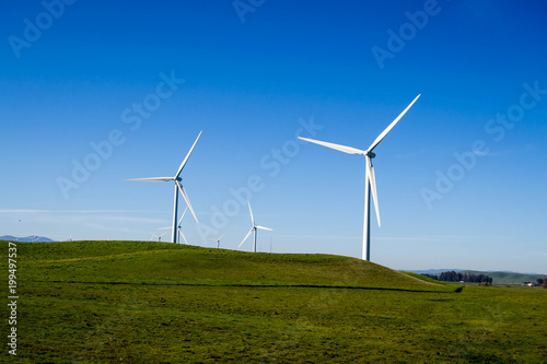 Windmills in open field
