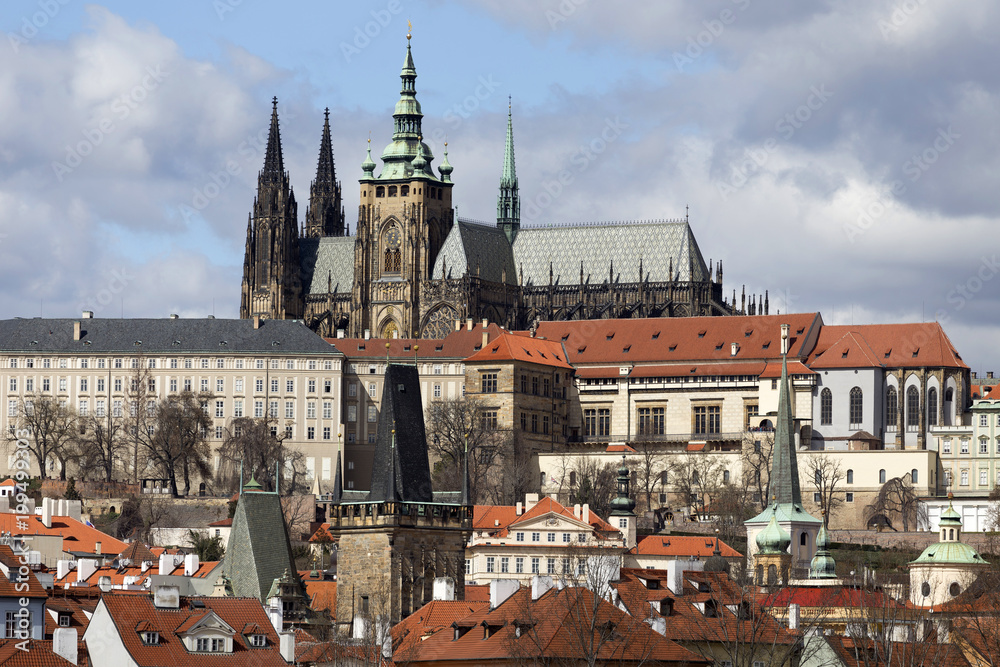 Obraz premium Early Spring Prague gothic Castle with the Lesser Town above River Vltava in the sunny Day, Czech Republic
