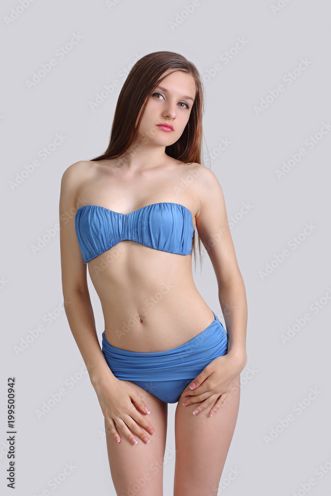 young cute girl posing in bikini Stock Photo | Adobe Stock
