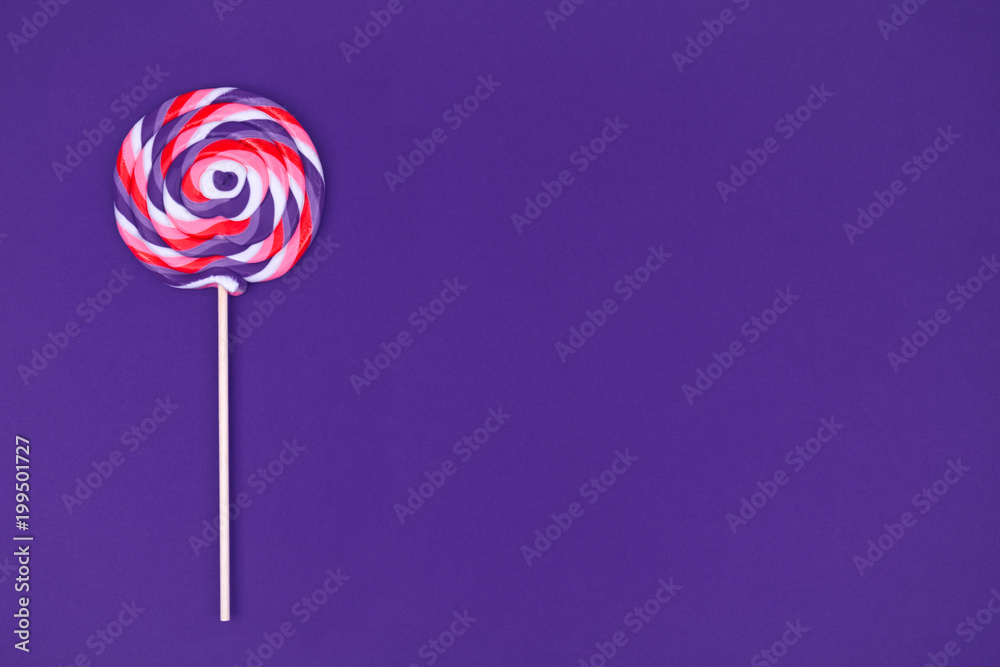 Big lollipop on solid ultra violet background Big lollipop on solid ultra violet background