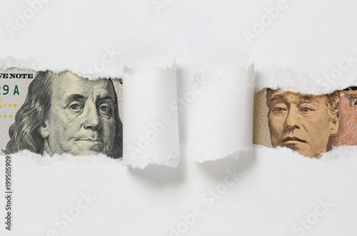 Japanese Money Note vs US Money Note on a While Background photo