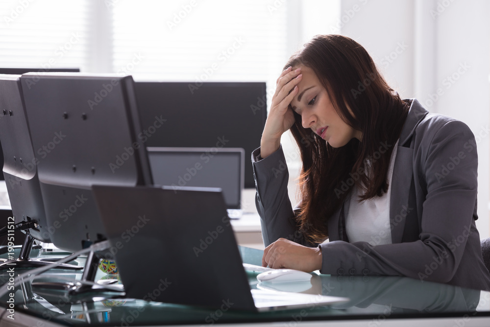 Stressed Businesswoman Sitting In Office Stressed Businesswoman Sitting In Office