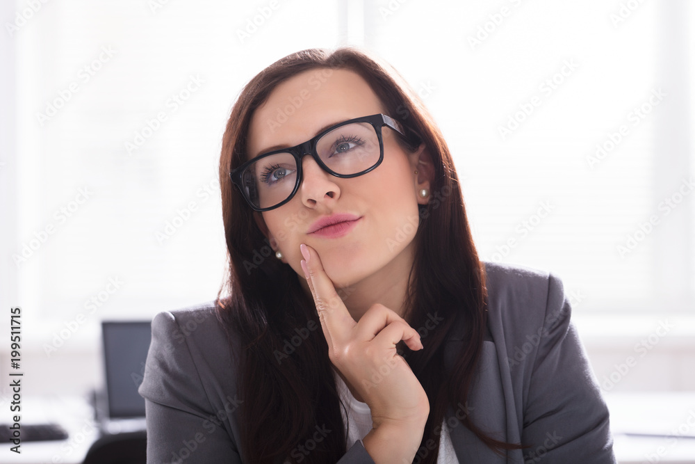 Close-up Of A Contemplated Businesswoman Close-up Of A Contemplated Businesswoman