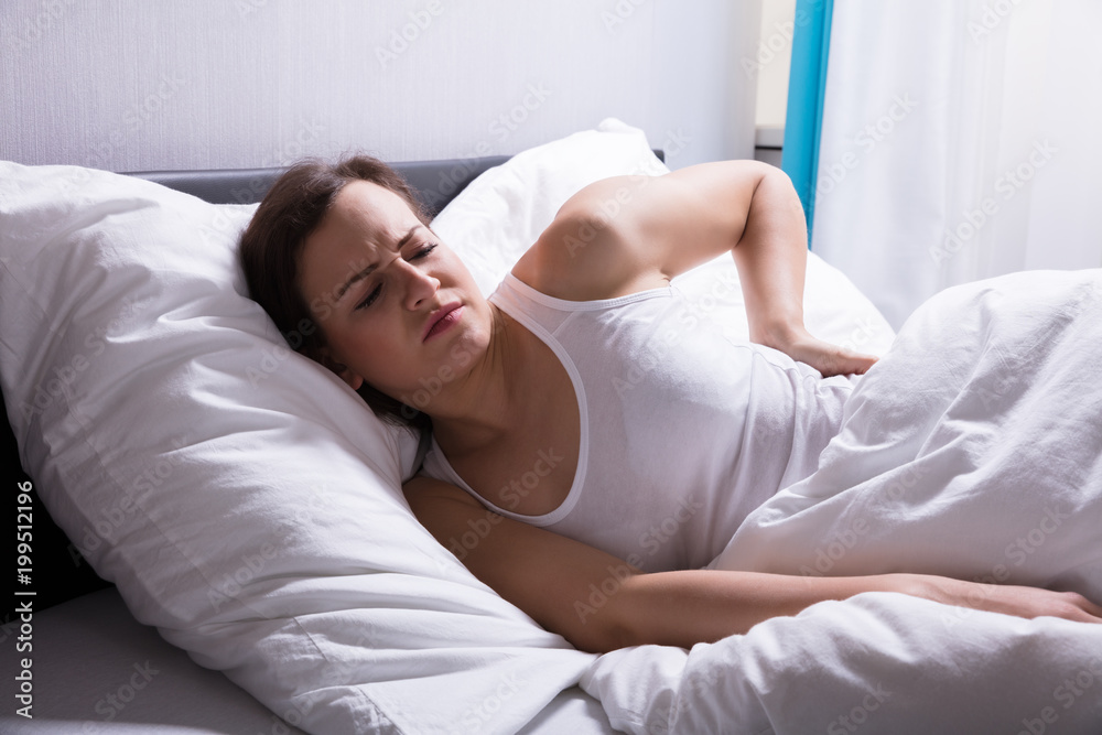 Woman Suffering From Back Pain Woman Suffering From Back Pain