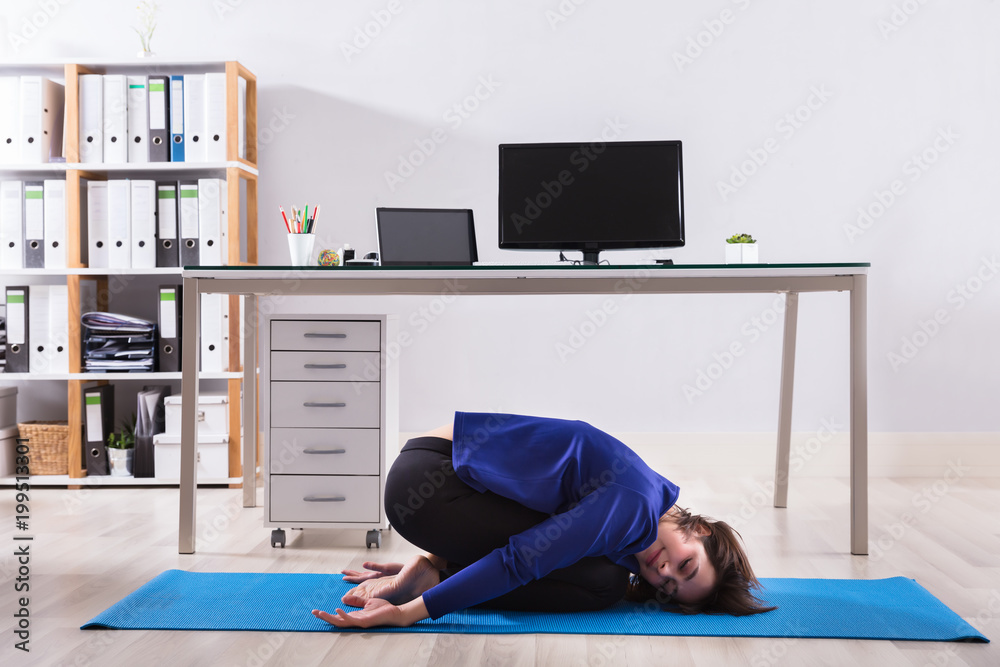 Businesswoman Doing Workout In Office