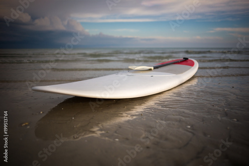 Stand up paddle board on the beach © John