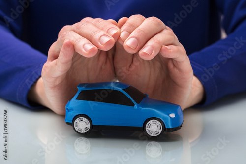 Person Protecting Small Car