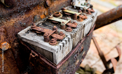 Vintage antique automotive wooden ignition coils covered in rust and age photo