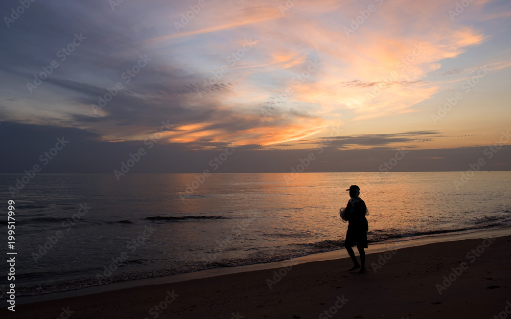 People stood watching the sea, Sunrise and happy People stood watching the sea, Sunrise and happy