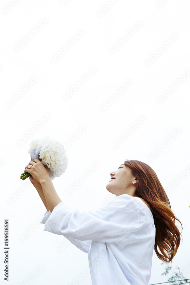 Korean woman holding flower bouquet Korean woman holding flower bouquet