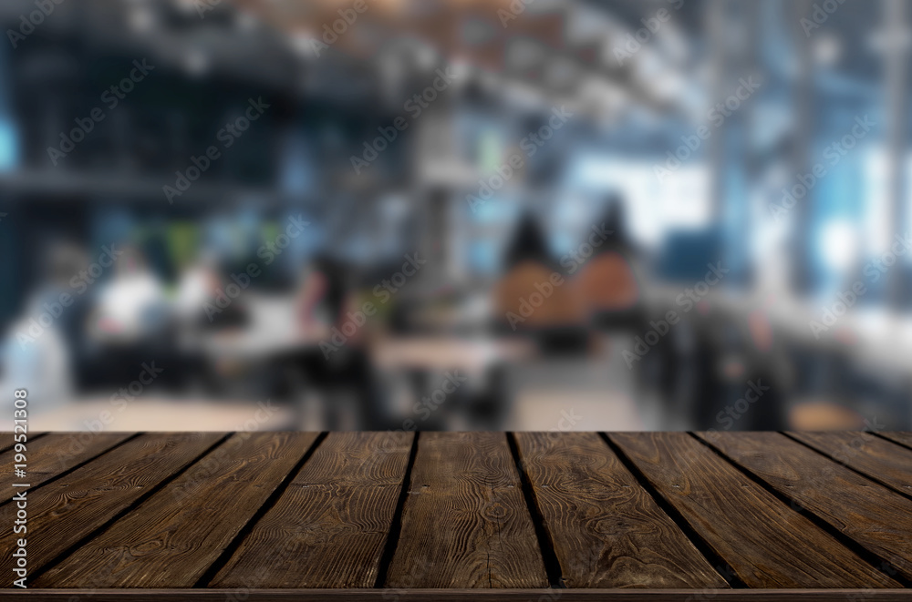 Selected focus empty brown wooden table and Coffee shop or restaurant blur background with bokeh image. for your photomontage or product display. Selected focus empty brown wooden table and Coffee shop or restaurant blur background with bokeh image. for your photomontage or product display.
